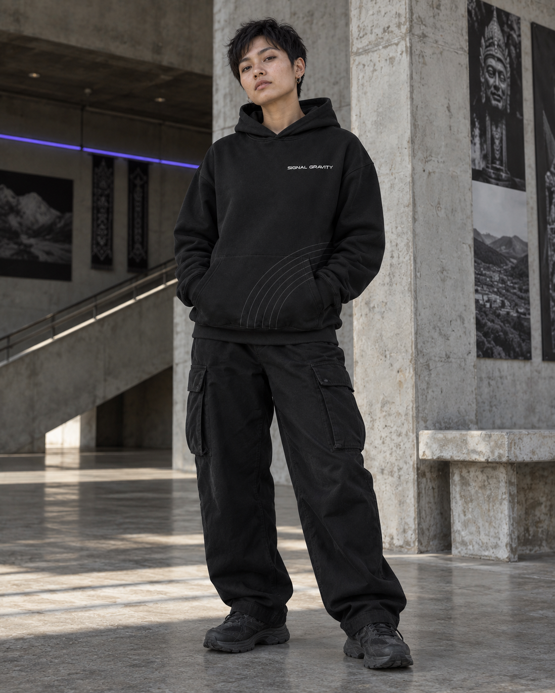 Female model wearing Signal Gravity Hoodie - Black