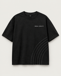 Signal Gravity Relaxed Tee - Washed Black, front view on warm neutral background